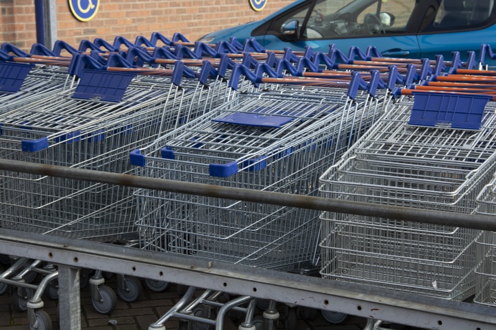 Corby, U.K, 19 March 2019 - A long row of shopping trolleys carts at LIDL Shop, outside of a large supermarket.