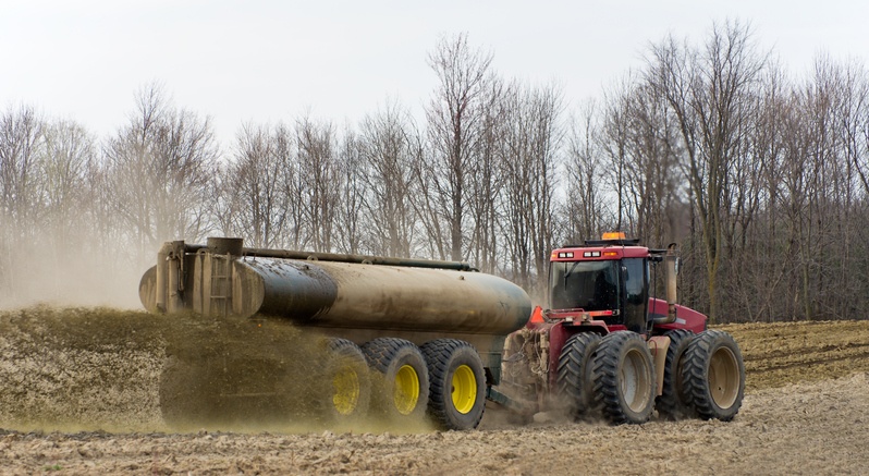 Farmer Spreading Liquid Manure