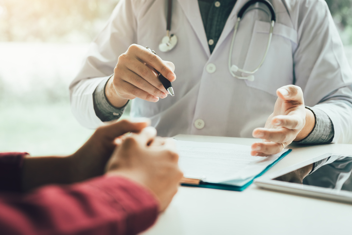 Doctor talking to the patient about menopause and treatment in future.