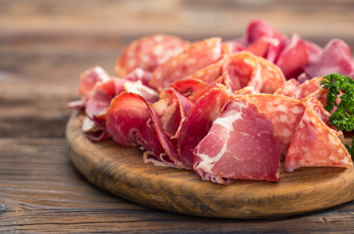 Meat platter with delicious salami, sliced ham, sausage, and bacon